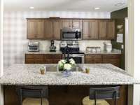 Kitchen Island with sink, dishwasher and room for two bar stools