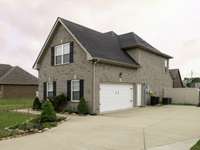2 car side attached garage with concrete driveway