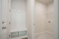 Entrance from garage-drop zone and laundry