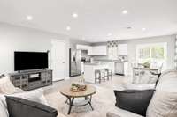Open concept great room, dining room, and kitchen area. Great room dimensions : 15’6” x 12’6”