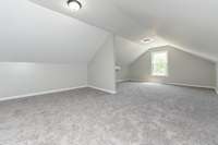 Upstairs bonus room, recreational or multipurpose room(Vacant Photo from 2023, prior to the current owner’s purchase)