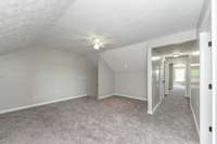 Upstairs bonus room, recreational or multipurpose room.(Vacant Photo from 2023, prior to the current owner’s purchase)