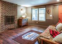 This guest room ensuite features accents from the Great Lodge at Walt Disney World. There is also a Parisian balcony overlooking the entertainment area, plus a private screened-in covered porch overlooking secluded wooded areas viewed for miles.
