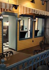 Grab your hors d'oeuvres and libations and watch a performance from the extension of the diner.