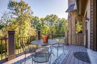 Exterior Dining area and grilling deck overlooking private backyard with the essence of many acres of green space.
