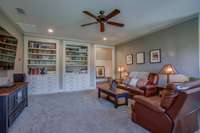 Media Room/Den serves as a main hub for fun and relaxation. The thoughtfully designed cabinetry has 16 drawers for all your media storage needs. This room also features a study area with shelving above.