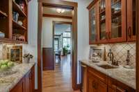 Butlers pantry-  Entertaining just got easier with the well-equipped butler's pantry with a 10" deep sink, a built-in icemaker, and plentiful shelving and cabinetry. Huge walk-in pantry just around the corner.