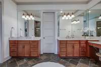 Extensive beveled mirrors above the vanities.