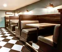 Escape to the small-town diner and enjoy a meal in the authentic restaurant booths. Order at the marble service counter. There's a large, hidden storage area with a custom-built vault and a hidden workshop with built-in tool organization.