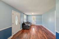 The living room is spacious, freshly painted and features new LVP flooring. Beautiful!