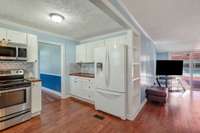 Spacious and updated kitchen features back splash, updated LVP flooring