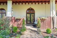 Front porch and beautiful garden plantings