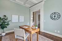 The room to the left of the foyer would make a great office or reading room.
