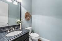 The powder room is right off the kitchen.