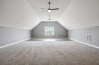 The upstairs bonus room is HUGE. What would YOU do with this pristine space?