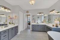 Separate vanities, freestanding tub and walk in shower.