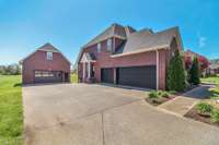 AMAZING detatched garage!! It features new doors, floored attic and heat and air.