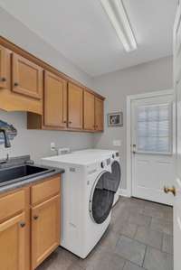 The laundry room leads to the driveway.