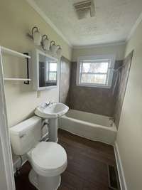 New flooring, new toilet, new mirror.