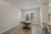 This dining space is adjacent to the kitchen and has plenty of room for a 6 or even 8 person table.