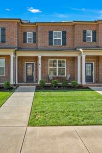 Great curb appeal thanks to the full covered front porch, shutters, and three quarter light front door.