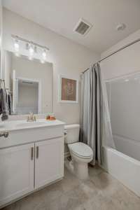 The second full bathroom on the second level which is shared by bedrooms two and three.