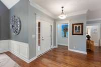 Foyer leading to the hallway that leads to upstairs.