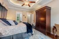 The primary suite exudes luxury with its soaring vaulted ceilings, fresh renovations, and elegant fixtures, creating a serene retreat that blends comfort and sophistication.
