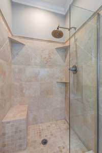 Step out of this walk-in shower onto HEATED Travertine Stone. The spacious tile walk-in shower is a true highlight, featuring sleek, modern tiles and a thoughtfully designed layout that enhances both style and functionality.