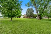 Set on a spacious, well-maintained lot, this property offers plenty of room for outdoor activities and future possibilities. The lush, expansive grounds are thoughtfully cared for, creating a peaceful and private setting.