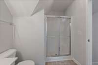The additional bathroom offers both practicality and comfort, providing a convenient space for guests or family members.