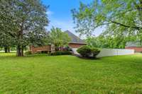 A sturdy privacy fence, providing a tranquil and secure outdoor space. This thoughtful addition ensures both seclusion and peace of mind, creating the perfect environment for relaxation, entertaining, or enjoying the outdoors in complete privacy.