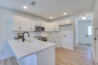 Large island provides extra seating options and makes entertaining easier.