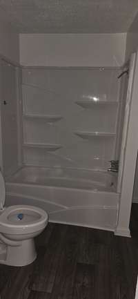 Tub /shower combo in bathroom.