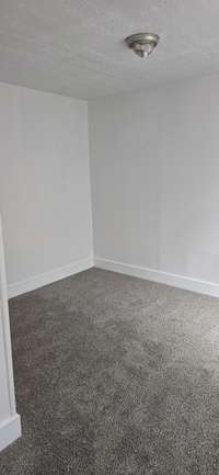 Bedroom #2 located across the hall from bedroom #3.