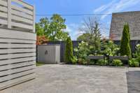 Garden boxes in this fully fenced property with sealed gravel stone (behind concrete) for ultimate low maintenance