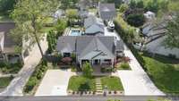 A drone view of the front of the house and property
