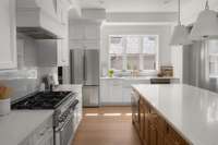 Gas range, farm sink, large island