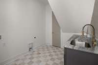 Downstairs laundry with sink