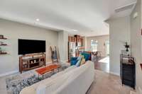 Living room opens into kitchen and dining