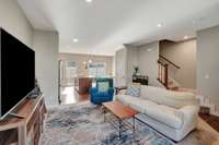 Living room opens to kitchen and dining area
