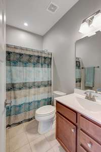 Upstairs bathroom with shower/tub combo and linen closet