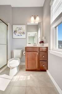 Primary en suite bathroom with walk-in shower.