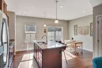 Kitchen with dining area. Look at all that natural light!