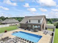 AND here is the back yard. Huge concrete area to have all the people over! Great condition pool too.