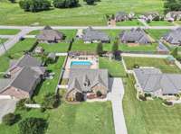 Located on a double cul-de-sac street, this home is in a super quiet part of the neighborhood and even has a tennis court laid out on the street!