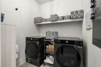 *SLIDING BARN DOORS LEAD INTO THE WALK-IN LAUNDRY ROOM*
