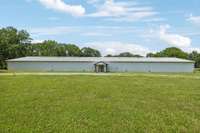 10,000 Sq Ft Barn Featuring 22 Horse Stalls and 1 Bedroom Apartment