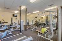 Photos of the clubhouse and fitness area.