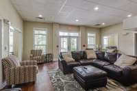 Photos of the clubhouse and fitness area.